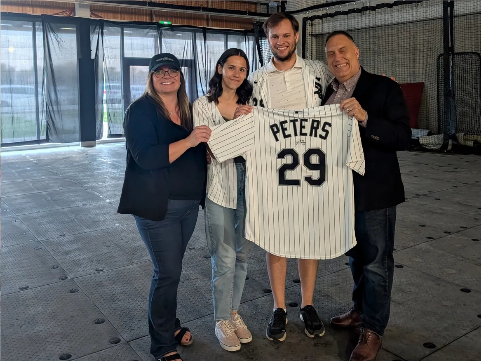 Tristan's brother Darius and his wife Keisha presented autographed Jersey to Carrie Hiebert MLA Morden-Winkler and Henry Siemens Mayor of Winkler